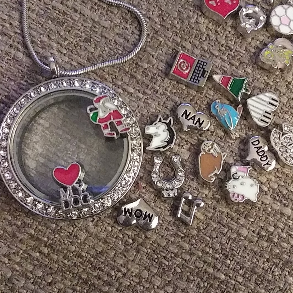 A Locket with Chain and floating Charms